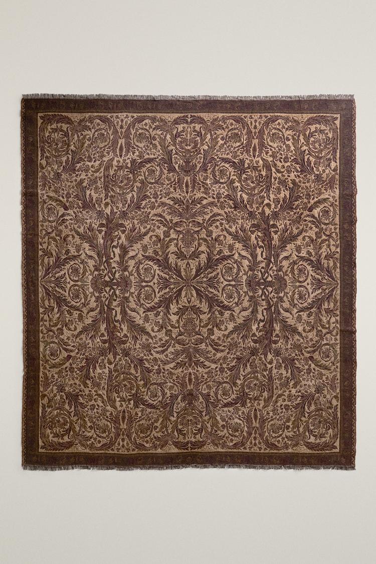FLORAL JACQUARD BLANKET WITH FRINGE